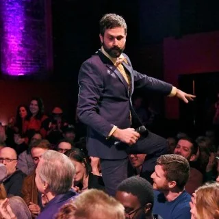Scot Nery interacting with the audience during a performance at Boobietrap
